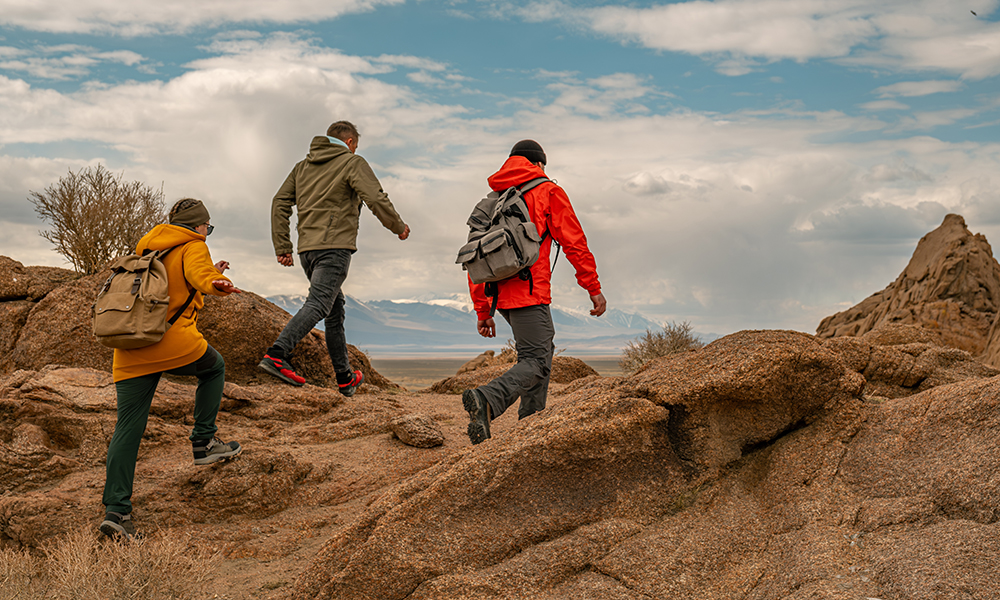 Tourists hiking along the sandy mountains in Mongolia